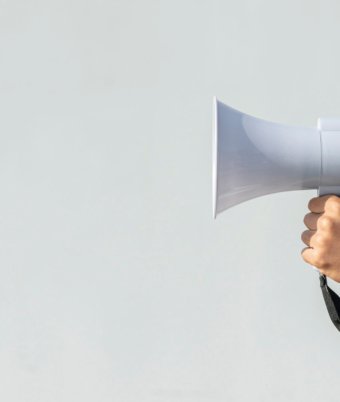 hand-holding-megaphone-protest